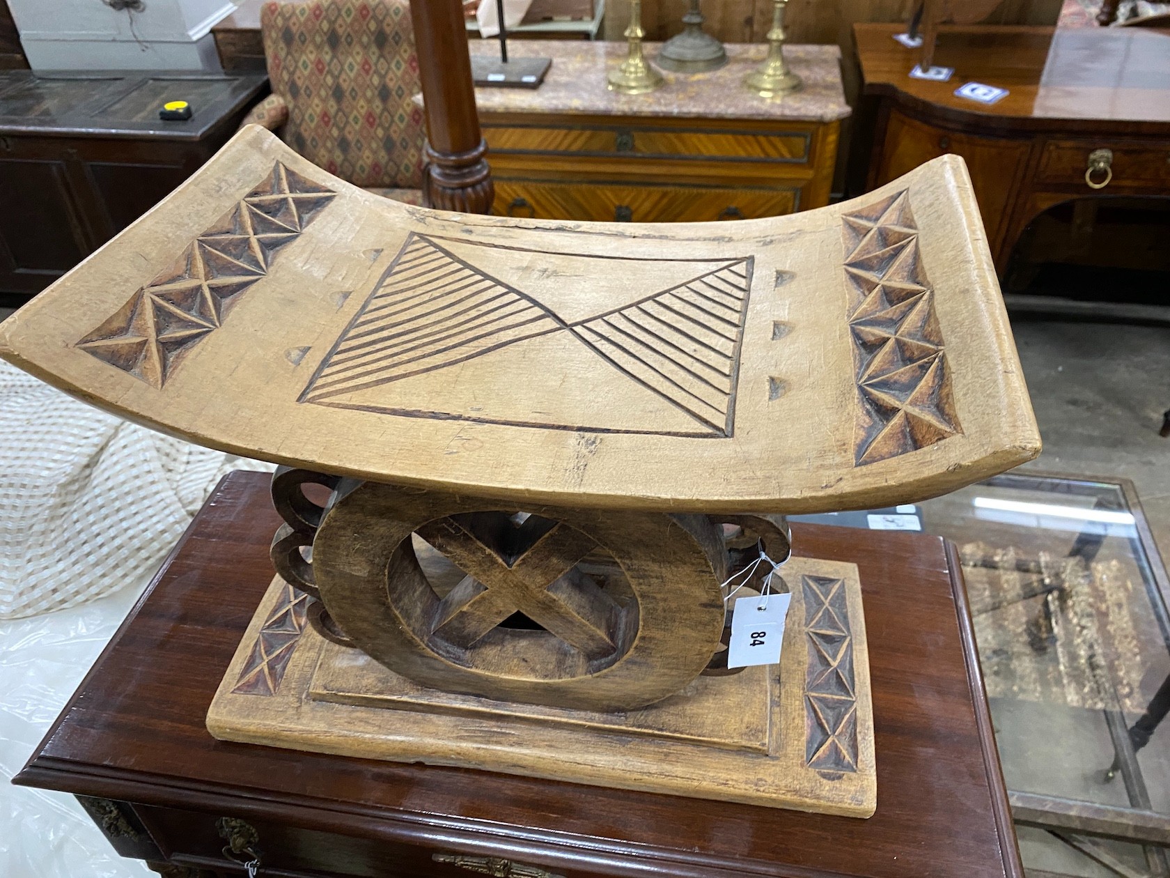An African carved hardwood stool, width 49cm, depth 27cm, height 38cm